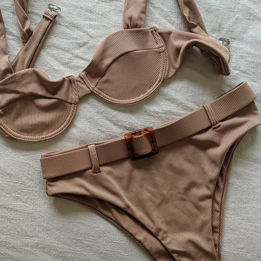 She In beige bathing suit high waisted